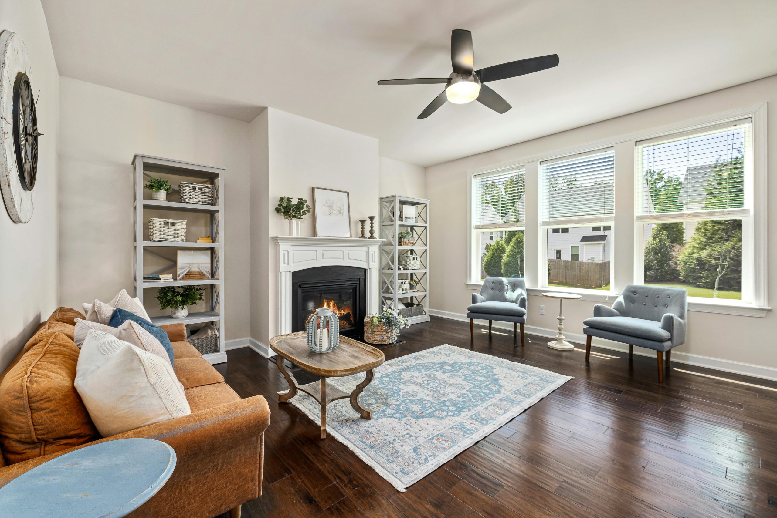 properly ventilated living room with the blinds up, letting natural light in